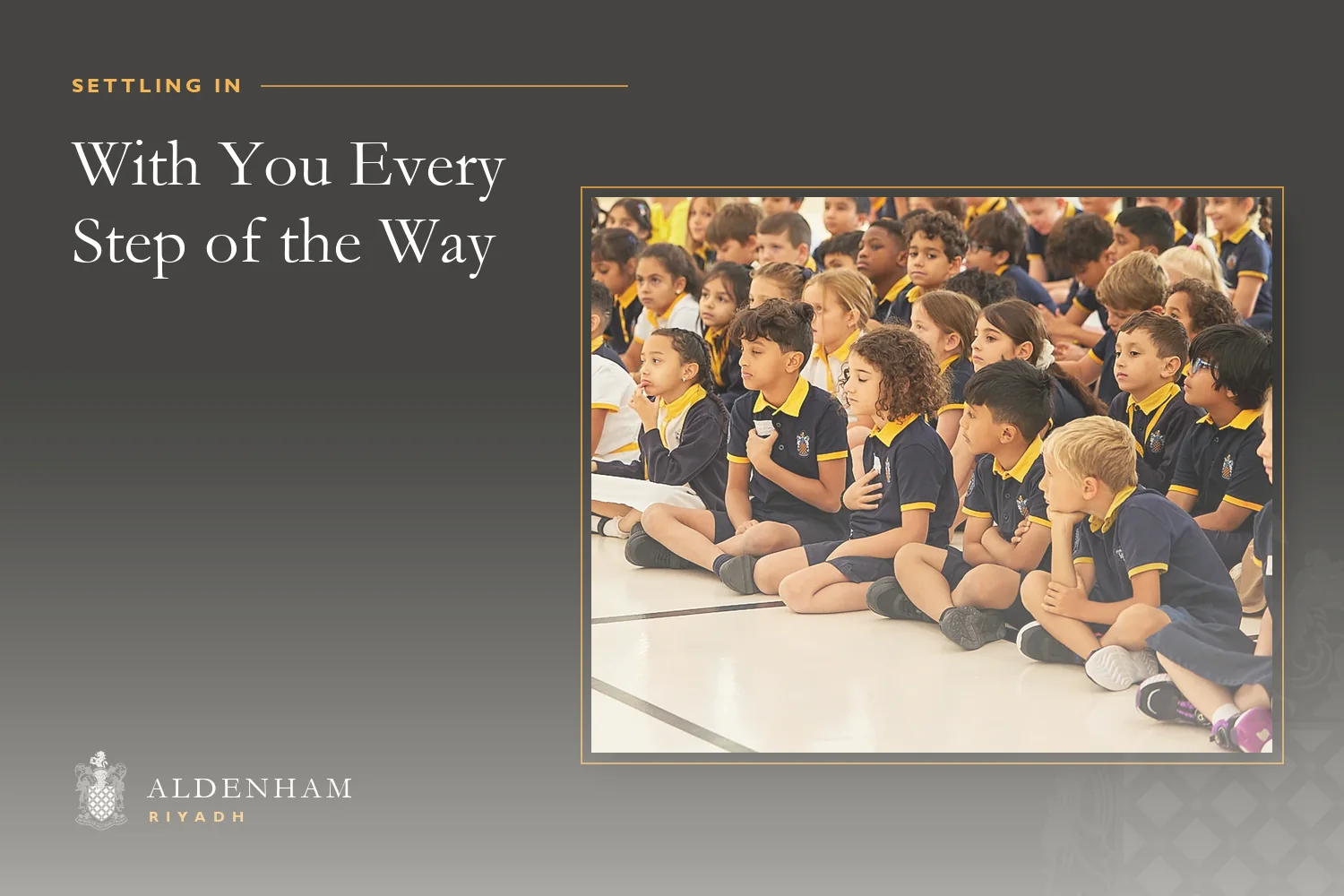 Young pupils at Aldenham School Riyadh sitting in rows on the floor of the atrium during the first-day assembly