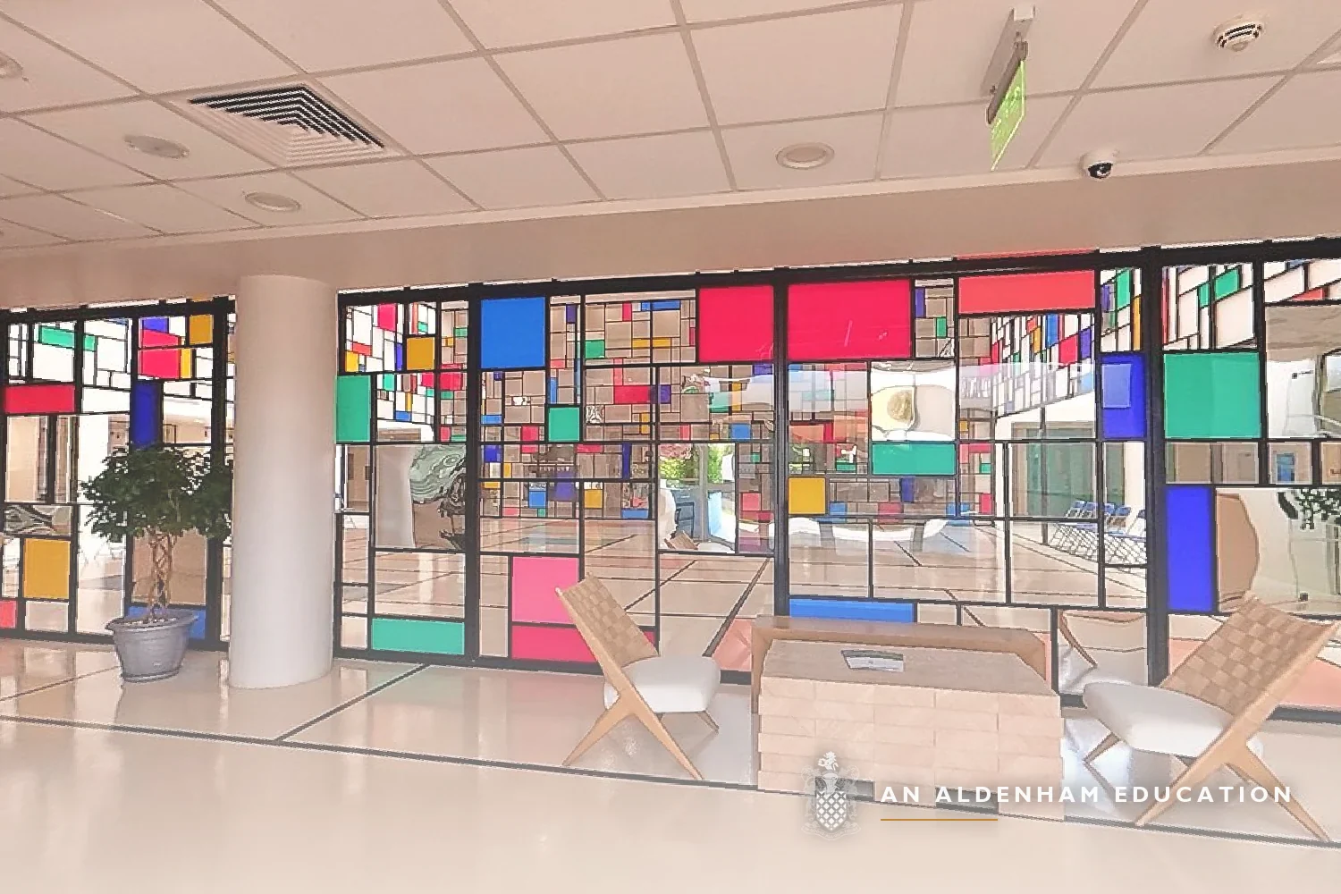 Admissions reception area at Aldenham School Riyadh with colourful stained-glass panels