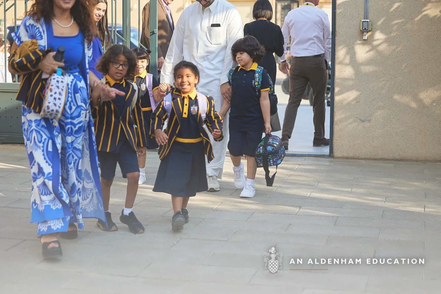 Pupils in Aldenham School Riyadh blazers and uniform arriving at school with their parents